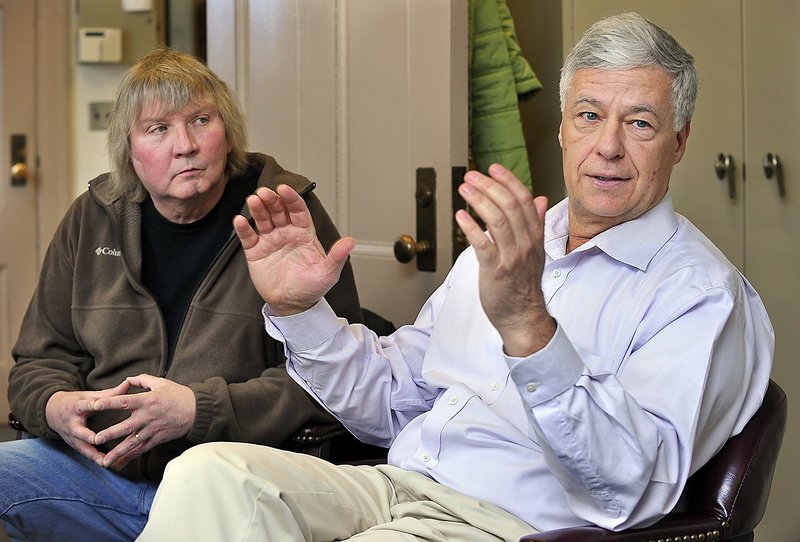 Millinocket Selectman Mark Marston, left, listens in April 2011 as Rep. Mike Michaud discusses his view of the situation with the closed Katahdin Paper Mill in East Millinocket, his hometown.