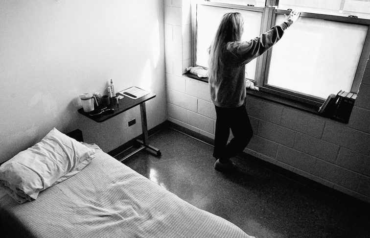 An opioid addict looks out the window of her room at a detox center in Black Mountain, N.C. Officials have declared a national epidemic, as addictions to prescription painkillers have skyrocketed and fatal overdoses have more than tripled in the past decade.