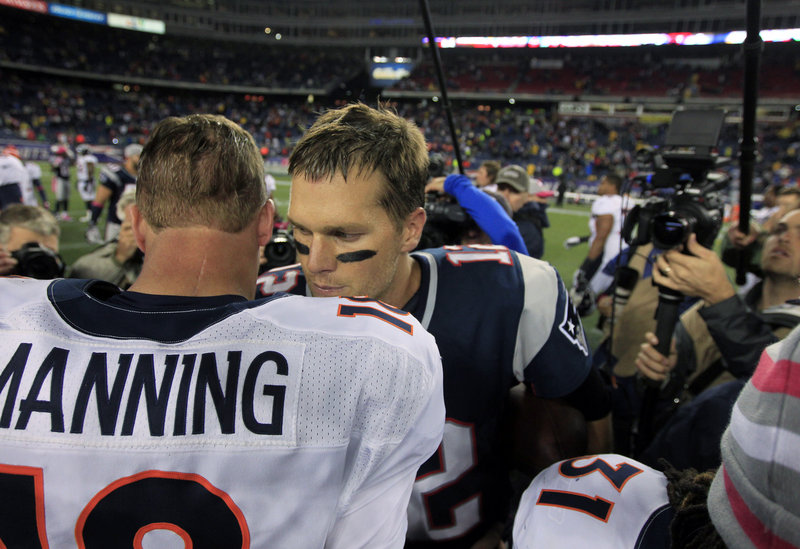 Old rival Peyton Manning, in his first game against New England as a Denver Bronco, converses with Tom Brady at the conclusion of the Patriots’ victory.