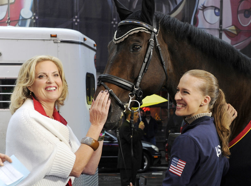 Ann Romney pets Lord Luger as his rider, Rebecca Hart, a para-equestrian champion, joins her on “Good Morning America” in New York on Wednesday.