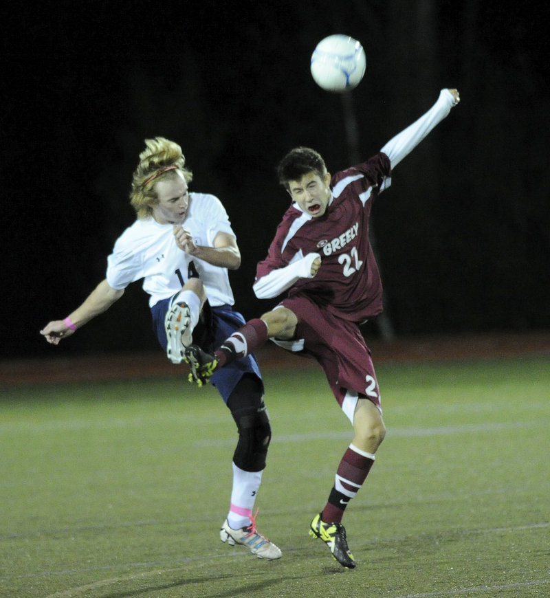 Ethan Cyr, left, of Yarmouth and Miles Shields of Greely are in perfect step as they compete for the ball during Greely’s 2-0 victory in a Western Maine Conference game.