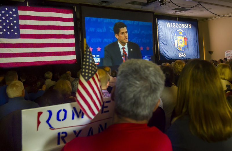 Supporters watch Republican vice presidential nominee Paul Ryan debate Vice President Joe Biden on TV in a Janesville, Wis., hotel. Ryan's record contradicts his current feelings about Obamacare and food stamps.