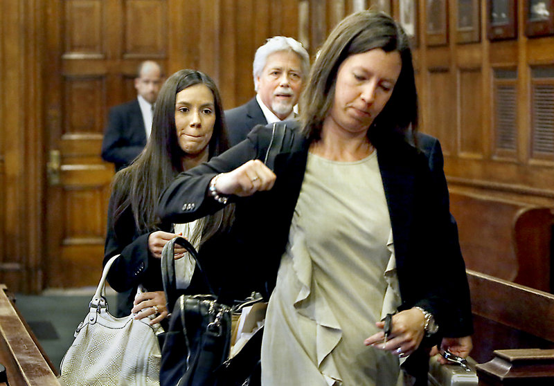 Alexis Wright, left, leaves a Cumberland County courtroom with her attorney, Sarah Churchill, front, as Mark Strong Sr., center, talks with his lawyer after their arraignments in Portland on Oct. 9. Police plan to release the names of alleged clients in the prostitution case in which Wright and Strong are embroiled.