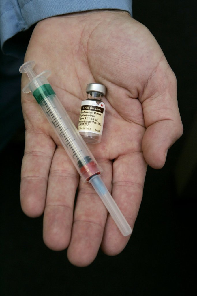 A doctor holds the human papillomavirus vaccine Gardasil, one of two HPV vaccines sold in the United States, in his Chicago office in 2006. HPV is the leading cause of cervical cancer and also has been linked with other types of cancer in both women and men.
