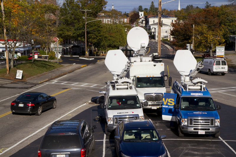 Several satellite trucks were stationed on Route 1 in Kennebunk on Tuesday, across the street from a former Zumba studio implicated in a prostitution scandal.