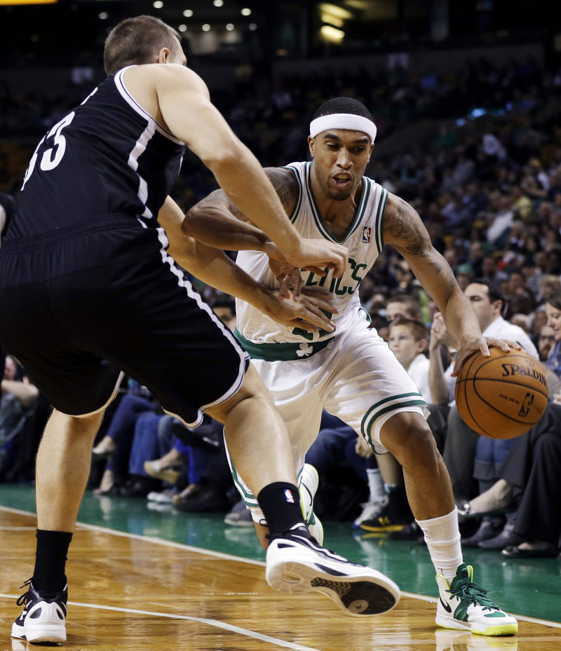 Courtney Lee, hoping to make a good first impression on Celtics fans in Boston, heads to the basket against Mirza Teletovic of the Brooklyn Nets.