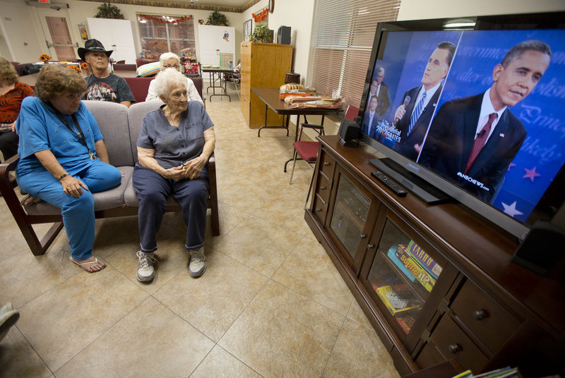 Residents of the Quail Ridge Manor independent living apartment comples in Boulder City, Nev., watch the presidential debate on Tuesday.