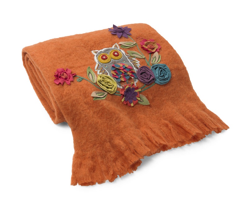 Appliqued flowers decorate a wool blend throw from HomeGoods.com.