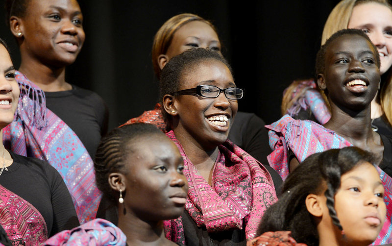 Judith Abdalla, an immigrant from Sudan, prepares to perform “Song for Malala” with the Pihcintu Multicultural Children’s Chorus Wednesday at Portland High School’s auditorium. Composed by songwriter Con Fullam, the song honors the Pakistani girl wounded by the Taliban and will be posted on YouTube with the hope of being an international sensation.
