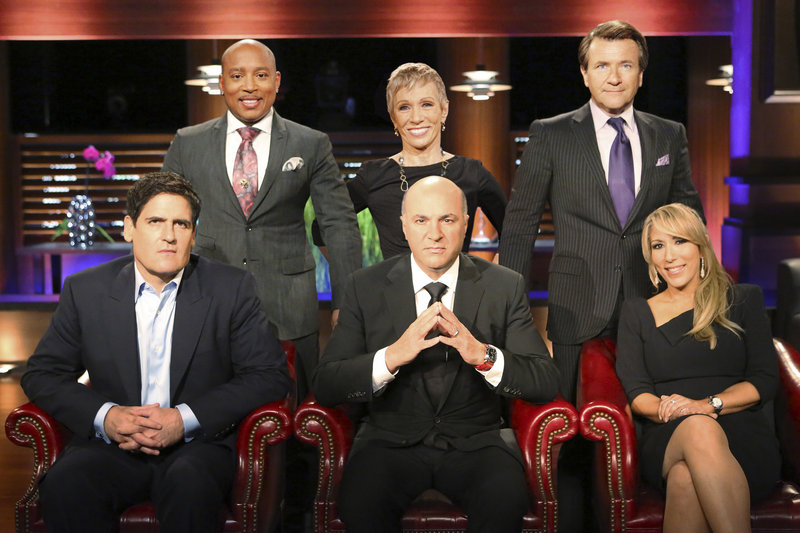 The panel of rich investors that often put entrepreneurs on the spot on the TV show “Shark Tank” are, front row from left, Mark Cuban, Kevin O’Leary and Lori Greiner, and back row from left, Daymond John, Barbara Corcoran and Robert Herjavec.