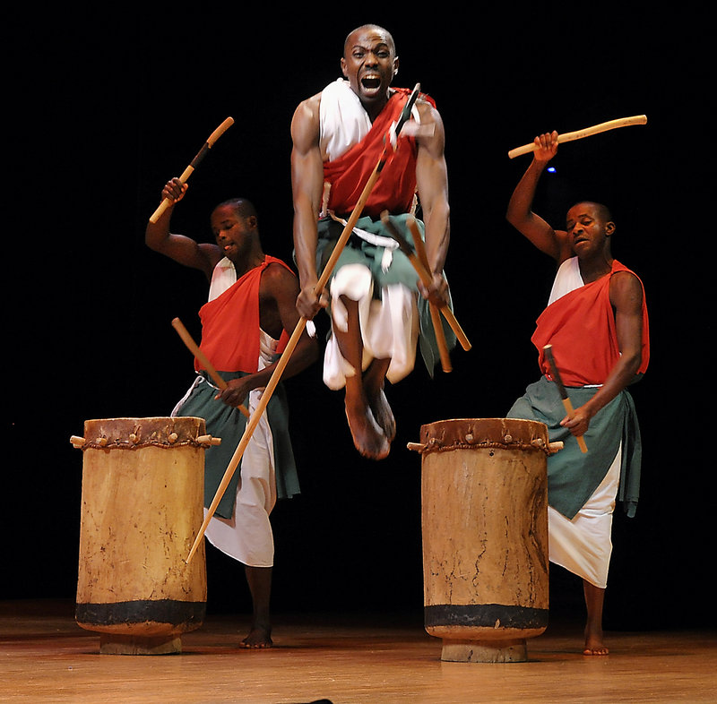 Members of the acclaimed Royal Drummers and Dancers of Burundi perform Thursday before nearly 2,000 students and teachers at Merrill Auditorium in Portland, yipping and yelling on stage to the delight of the kids.