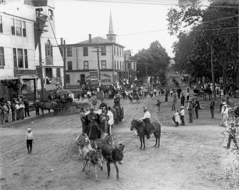 A circus parade makes its way down Main Street in Sanford around 1900. Buildings, from left, are the Brown Block built in 1896; the First Baptist Church; Nowell & Libby, now Shaw’s Hardware; and the Prescott Emery store.