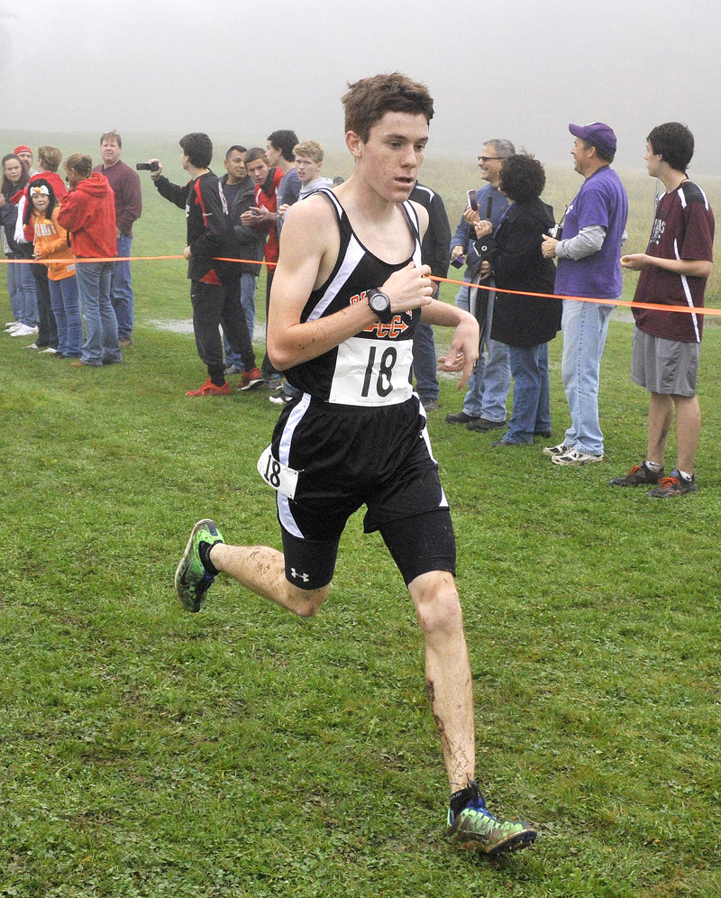 Cam Nadeau of Biddeford finishes third among Class A boys, behind Massabesic’s George Morrison and Michael Aboud.