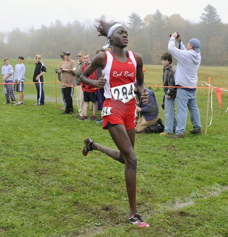 Nyajock Pan of South Portland heads for the finish line to win the Class A girls’ race with a time of 19:52.15.