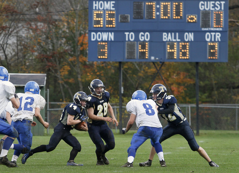 Anthony Sewall, above, of Traip Academy looks for running room last Saturday in Kittery during the final regular season game against Sacopee Valley. Traip led 55-0 at the half and went on to win 61-8, one of several lopsided victories among Maine teams this season that have prompted discussions about instituting a mercy rule.