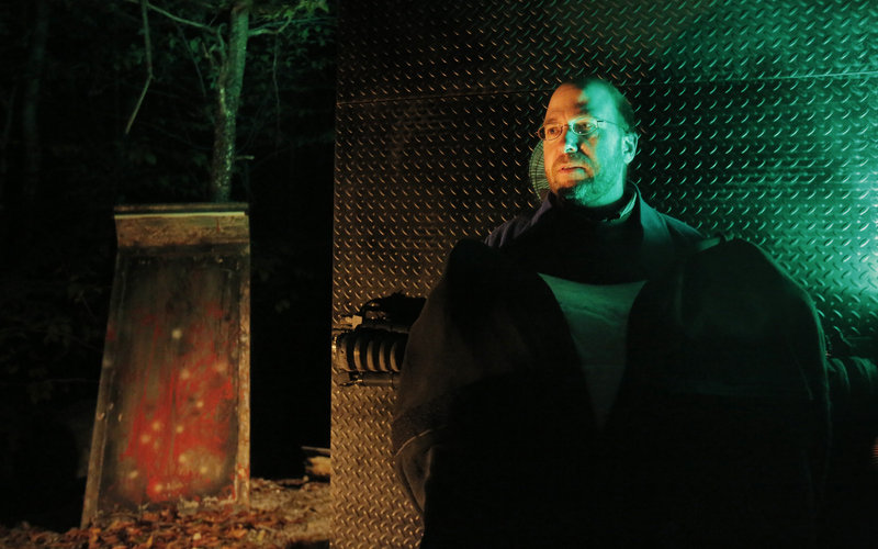 Reporter Ray Routhier takes a breather while playing the role of Frankenstein Oct. 12 at The Gauntlet, a haunted hayride attraction at Harvest Hill Farms in Mechanic Falls.