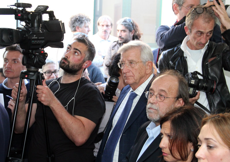 Defendants Claudio Eva, center, and Bernardo De Bernardinis, third from right, listen Monday as the verdict is read in an Italian court in a case that centered on expert statements made before a 2009 earthquake that killed 308 people.