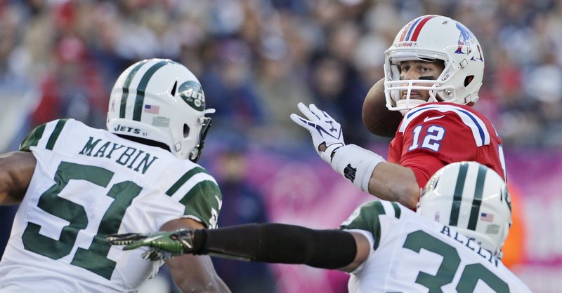 Tom Brady (12) got the Patriots’ offense going on the last two drives Sunday to beat the New York Jets in overtime.