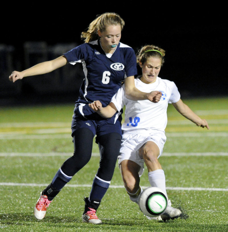 Falmouth’s Cassie Darrow, right, gets in front of Yarmouth’s Ariel Potter to control the ball during the Yachtsmen’s 2-0 Class B quarterfinal win at Falmouth on Tuesday.