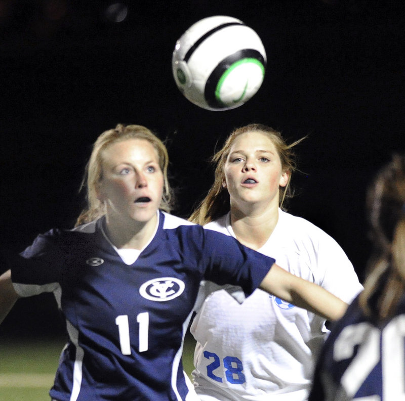 Yarmouth’s Alexa Sullivan, left, battles for position against Falmouth’s Laura Baer in Falmouth’s 2-0 win Tuesday. Yarmouth ends its season with a 5-7-4 record.