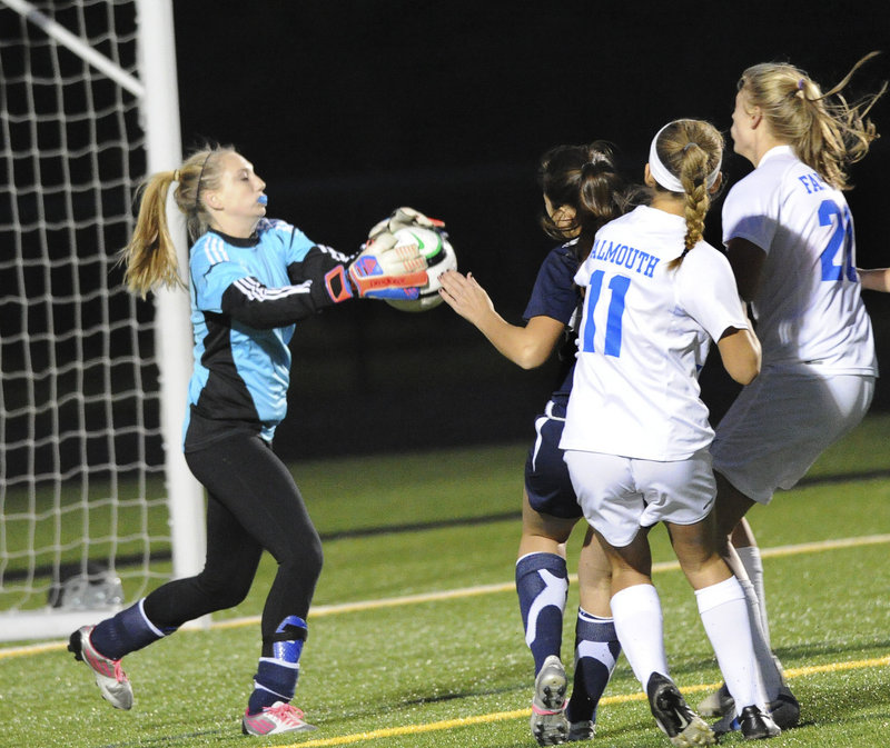 Yarmouth goalie Shannon Fallon, who had 13 saves in the game, comes out to make one of them in Tuesday’s game at Falmouth. The No. 2 Yachtsmen advanced with a win, and will now host sixth-ranked Gray-New Gloucester in a semifinal on Saturday.