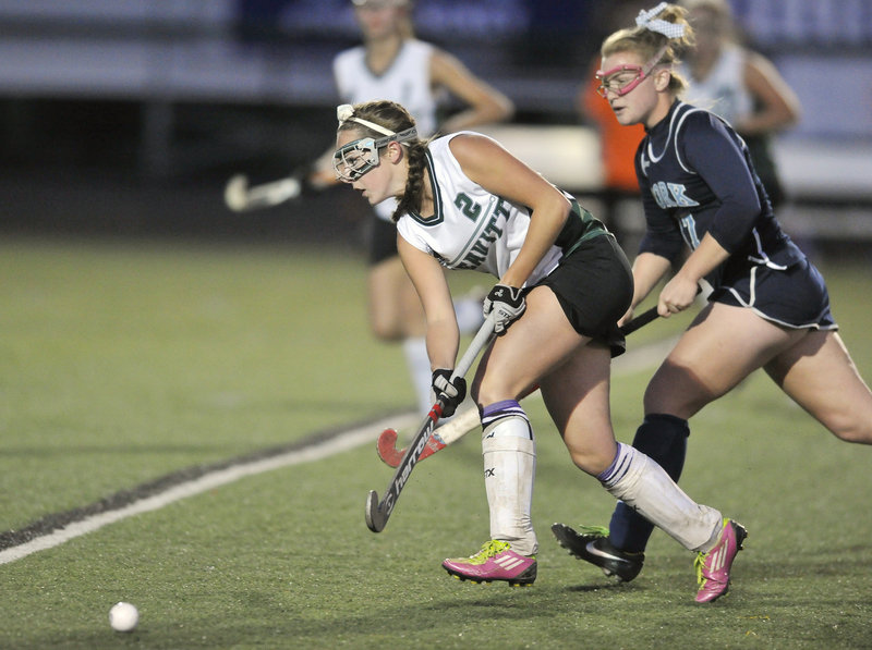 Bri DeGone, who scored the only goal of the game, drives the ball into the York zone ahead of Tori Stocks during Leavitt’s 1-0 victory. Leavitt will meet Belfast for the state title Saturday at Orono.