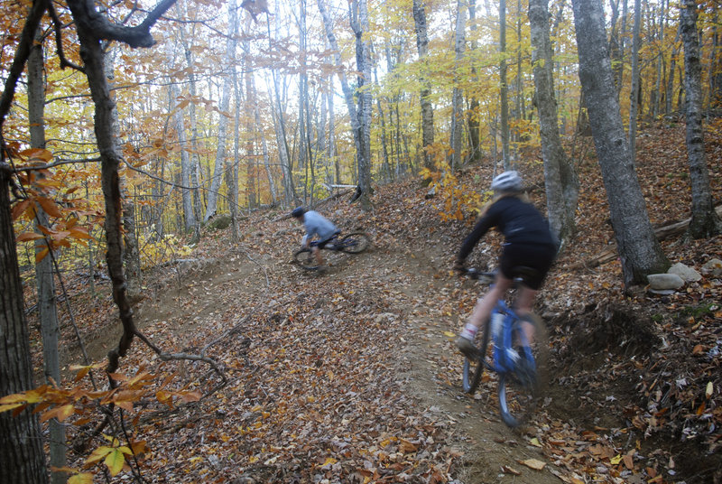 Members of the Camden Hills High mountain bike team train at the Camden Snow Bowl on Oct. 23. The month-old, 2,500-foot-long downhill course cost nearly $8,000 with the use of volunteer labor.