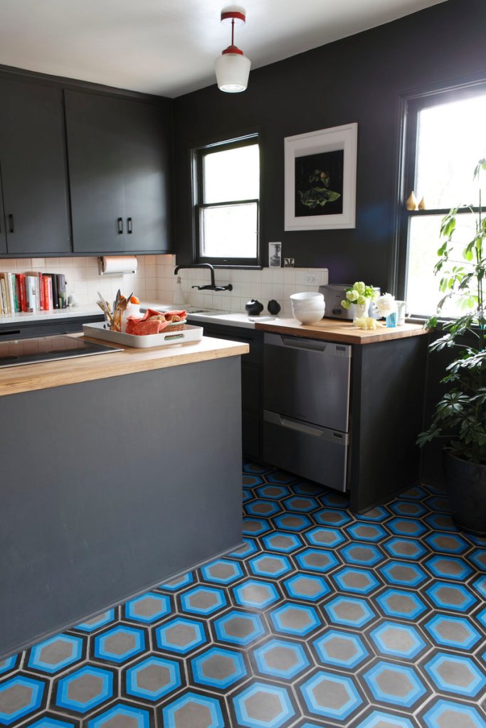 Hexagon #8 tile in shades of blue and gray in a kitchen floor by Kismet Tile