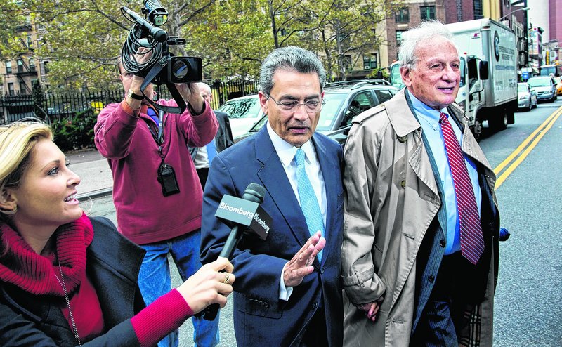 Former Goldman Sachs and Procter & Gamble Co. board member Rajat Gupta declines to answer a question from a reporter as he arrives Wednesday outside federal court in New York for his insider trading sentencing.