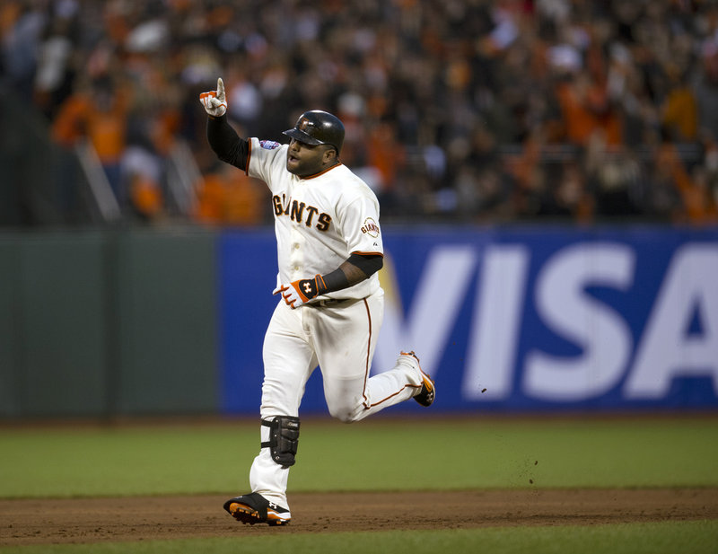 Pablo Sandoval of the San Francisco Giants rounds the bases Wednesday night after hitting the second of his three home runs against the Detroit Tigers in Game 1 of the World Series.