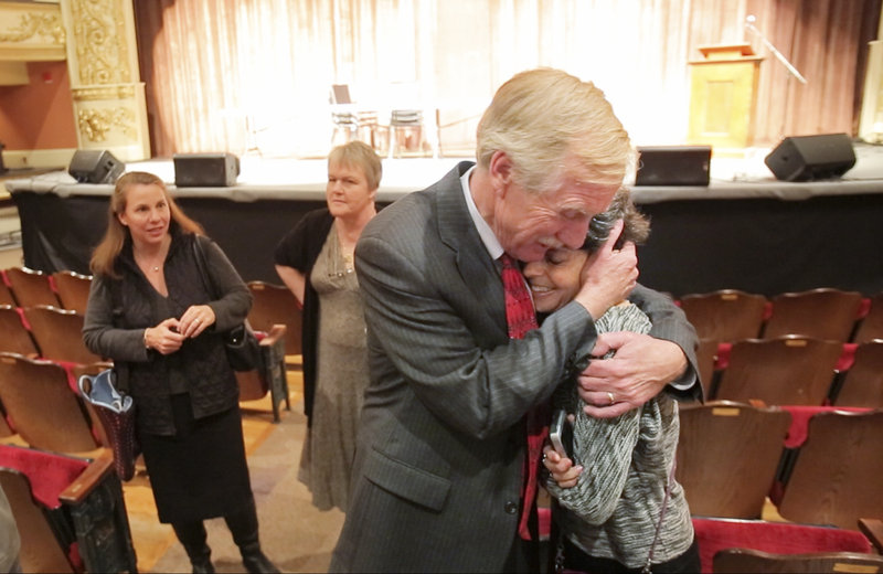 Angus King hugs his wife, Mary Herman, after a candidate forum Oct. 23 at the Waterville Opera House. Mary Herman, who runs a consulting business, joins her husband for campaigning some days and also does solo appearances.