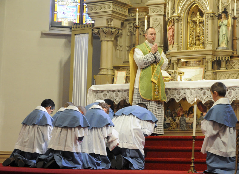 The Rev. Canon Andreas Hellmann prays during a Latin Mass at a church in Manitowoc, Wis. In 2007 Pope Benedict XVI called it a “precious treasure to be preserved.”
