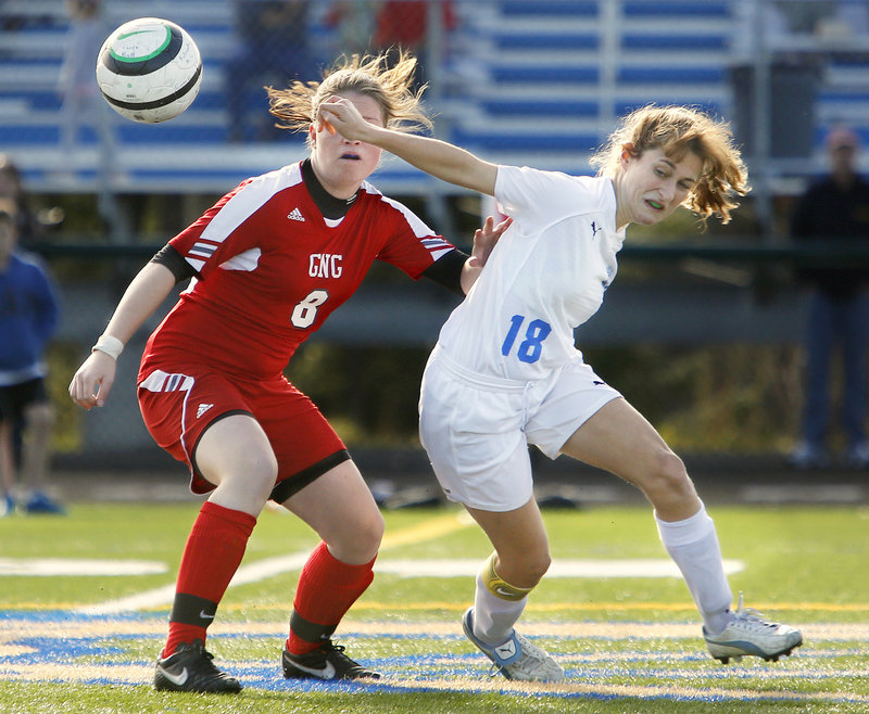 Alex Moeller, left, of Gray-New Gloucester, vies for the ball against Falmouth’s Cassie Darrow in second-half action of Saturday’s game in Falmouth.
