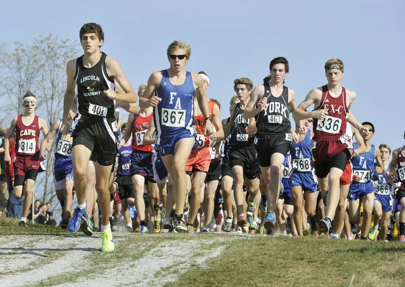 Nick Smelcer of Lincoln Academy leads the pack early in the Class B boys’ cross country championship race Saturday in Belfast. Dan Curts (336) of Ellsworth won the race, edging two-time champ Silas Eastman (367) of Fryeburg Academy by four-tenths of a second.
