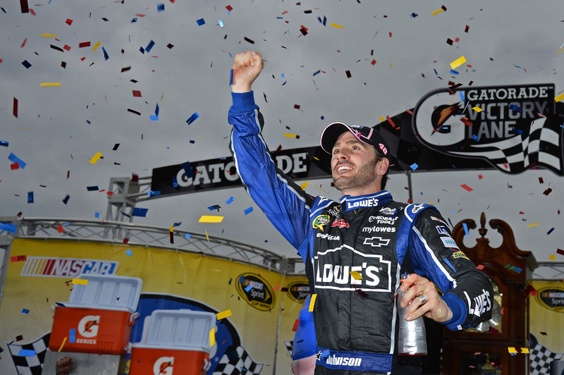 Jimmie Johnson celebrates after winning Sunday’s Sprint Cup race at Martinsville Speedway. With three races left, Johnson is in line for his sixth championship.