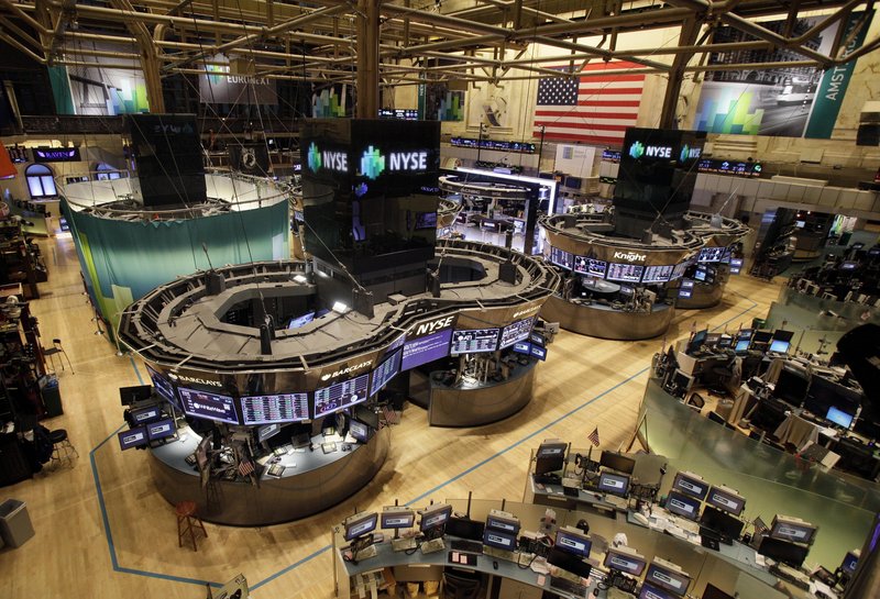 The floor of the New York Stock Exchange is empty of traders Monday in New York. Trading has rarely stopped for weather. A blizzard led to a late start and early close on Jan. 8, 1996, according to NYSE Euronext.