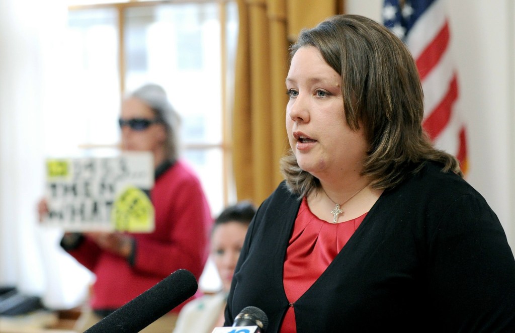 With a lone protestor in background, Rep. Diane Russell holds a press conference in April 2011 at Portland City Hall to advocate legalizing and taxing marijuana. Russell is once again pushing for legalization, one week after voters in Colorado and Washington helped those states become the first to legalize recreational use of the drug.