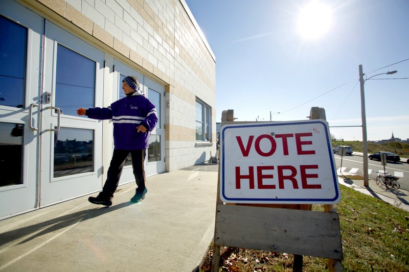 A voter enters the East End Elementary School in Portland on November 6, 2012. Tim Greenway/Staff Photographer