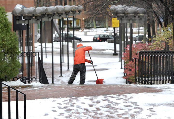Scott Woodward clears a path near One City Center on Thursday morning.