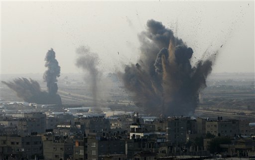 Smoke rises following an Israeli attack on smuggling tunnels on the border between Egypt and Rafah, southern Gaza Strip, Monday, Nov. 19, 2012. (AP Photo/Eyad Baba)