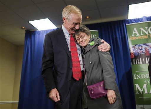 Independent Senator-elect Angus King hugs his wife, Mary Herman, after he spoke at a news conference, Wednesday, Nov. 7, 2012, in Freeport, Maine. King says he's heading to Washington this weekend and could decide as soon as next week, or after Thanksgiving, on which party he'll align himself with. The former two-term governor overcame challenges from Republican Secretary of State Charlie Summers and Democratic state Sen. Cynthia Dill to succeed retiring Republican Sen. Olympia Snowe. (AP Photo/Robert F. Bukaty)