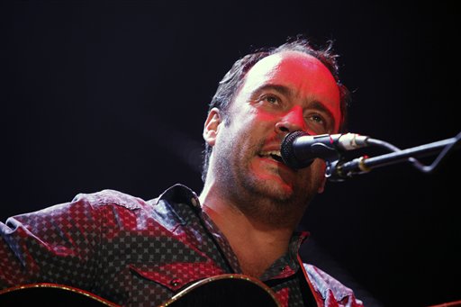 FILE - This Sept. 22, 2012 file photo shows Dave Matthews of the Dave Matthews Band performing during the Farm Aid 2012 concert at Hersheypark Stadium in Hershey, Pa. The band is giving $1 million to help Superstorm Sandy recovery efforts in New Jersey and New York. They announced Wednesday, Nov. 14, that the Nov. 30 opening show of their tour at the IZOD Center in East Rutherford, N.J., will be a benefit concert. All tickets and merchandise sales will go to the Bama Works Sandy Relief Fund, established at the Community Foundation of New Jersey. (AP Photo/Jacqueline Larma, file)