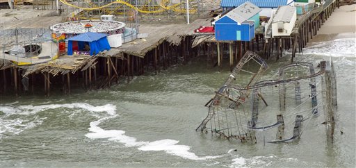 This Thursday, Nov. 1, 2012 aerial photo shows damage to the Casino Pier amusement park in Seaside Heights, N.J. caused by Superstorm Sandy, where part of the pier and a roller coaster fell into the ocean. (AP Photo/The Philadelphia Inquirer, Clem Murray) MAGS OUT, NEWARK OUT 304d43545934464c;696e717763