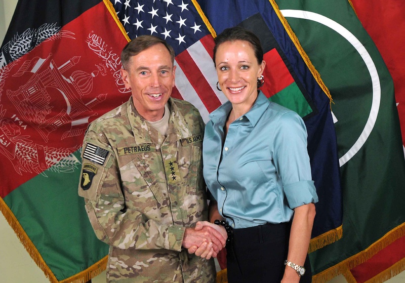 Davis Petraeus shakes hands with his biographer Paula Broadwell on July 13, 2011.
