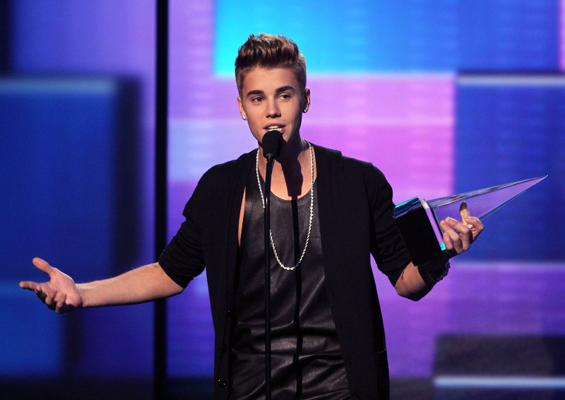 Justin Bieber accepts the award for favorite male artist - pop/rock at the 40th Annual American Music Awards on Sunday in Los Angeles.