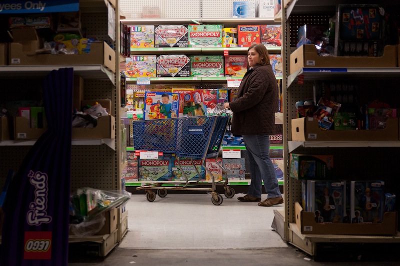 A customer examines shelves of toys during Toys "R" Us' Black Friday sales event in Flint, Mich. on Thursday, Nov. 22, 2012. (AP Photo/Flint Journal, Griffin Moores)