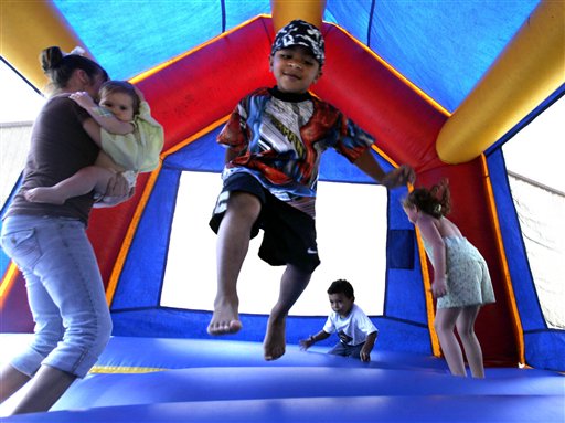 Children play in a bounce house in Vidor, Texas. A nationwide study found inflatable bounce houses can be dangerous and the number of kids injured in related accidents has soared 15-fold in recent years.