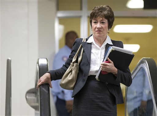 Sen. Susan Collins, R-Maine, ranking Republican on the Senate Homeland Security and Governmental Affairs Committee, walks to a meeting on Capitol Hill with UN Ambassador Susan Rice.
