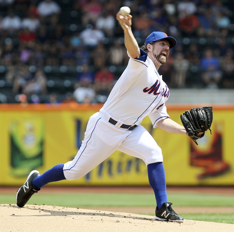 This Aug. 9, 2012 file photo shows New York Mets' R.A. Dickey pitching during the first inning of a baseball game against the Miami Marlins at Citi Field in New York. Dickey is a favorite to take home the AL Cy Young Award, Wednesday, Nov. 14, 2012. (AP Photo/Seth Wenig, FIle)