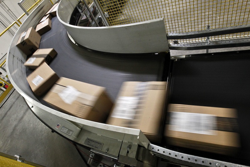 Packages ready to ship move along a conveyor belt at the Amazon.com 1.2 million square foot fulfillment center Monday, Nov. 26, 2012, in Phoenix. Americans clicked away on their computers and smartphones for deals on Cyber Monday, which is expected to be the biggest online shopping day in history. (AP Photo/Ross D. Franklin)